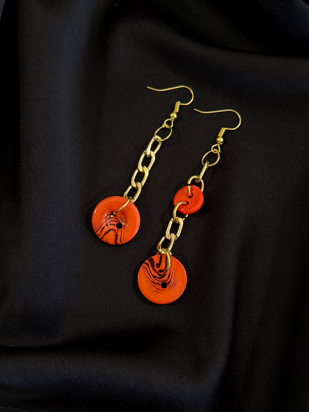 Asymmetrical Orange Buttons Drop