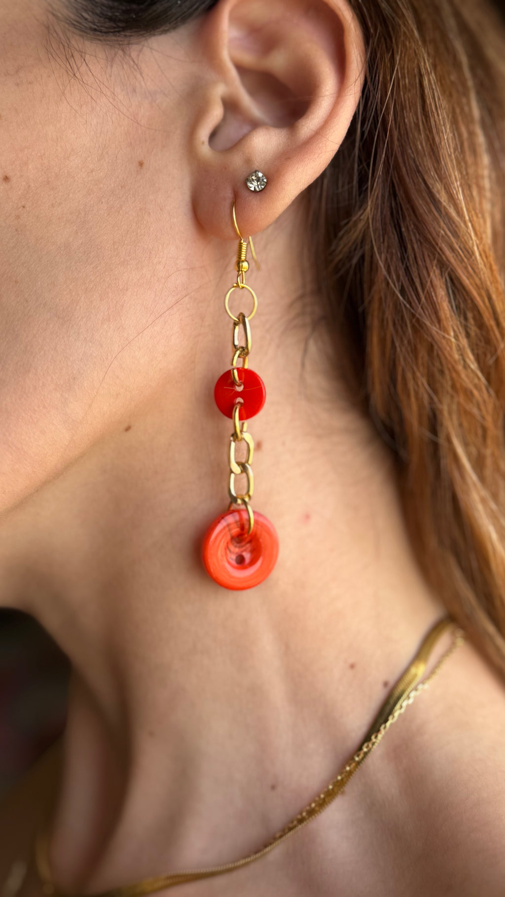 Asymmetrical Orange Buttons Drop