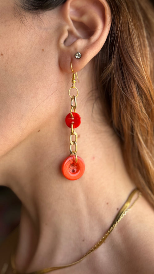 Asymmetrical Orange Buttons Drop