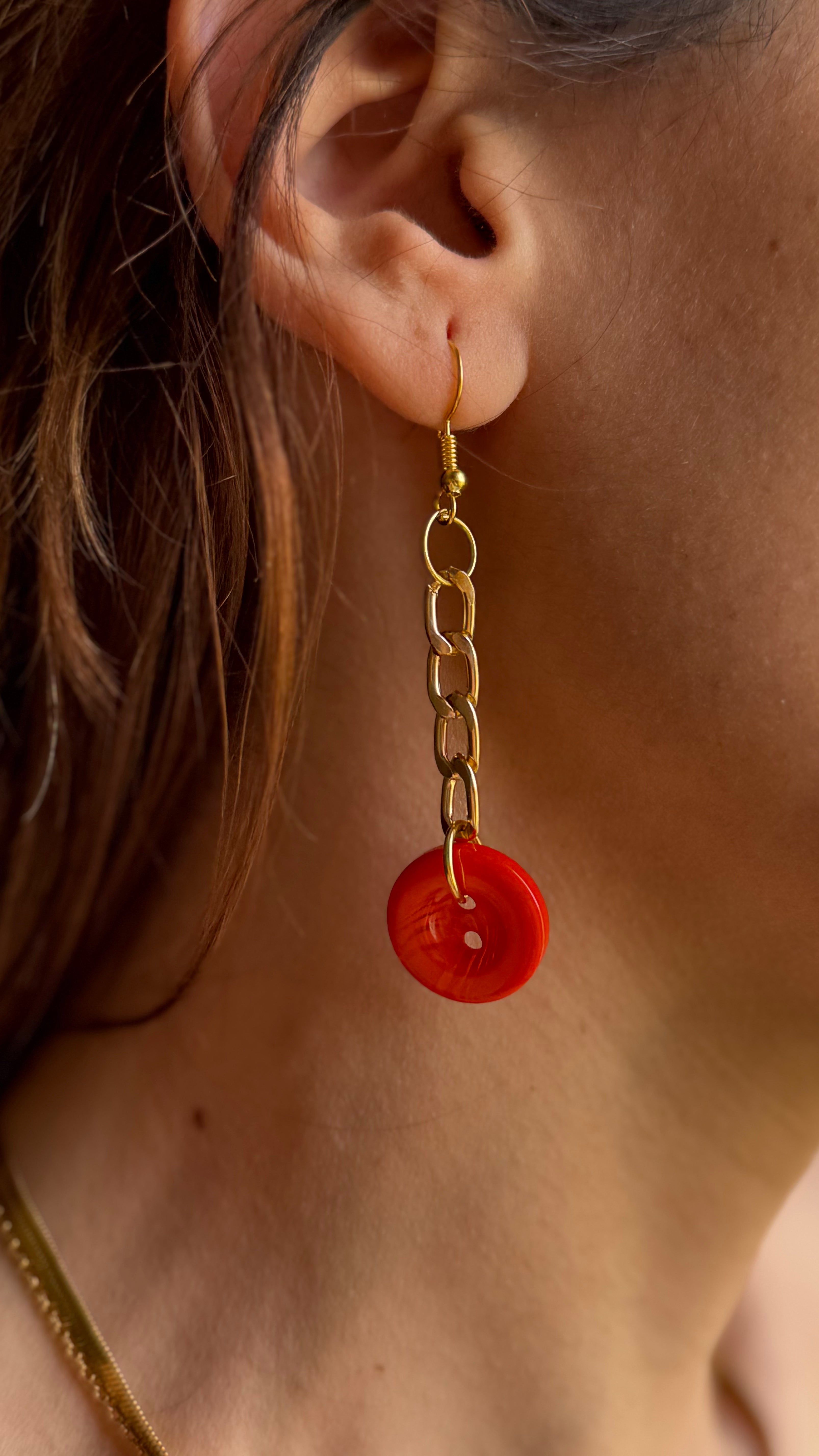 Asymmetrical Orange Buttons Drop